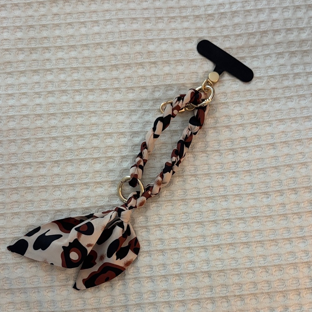 Womens Beige and Brown Leopard Print Cell Phone Bracelet Accessory.